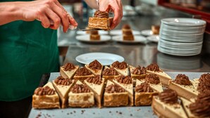 A person serving a dessert on a plate. - Cheela Plains Station (Nanutarra)
