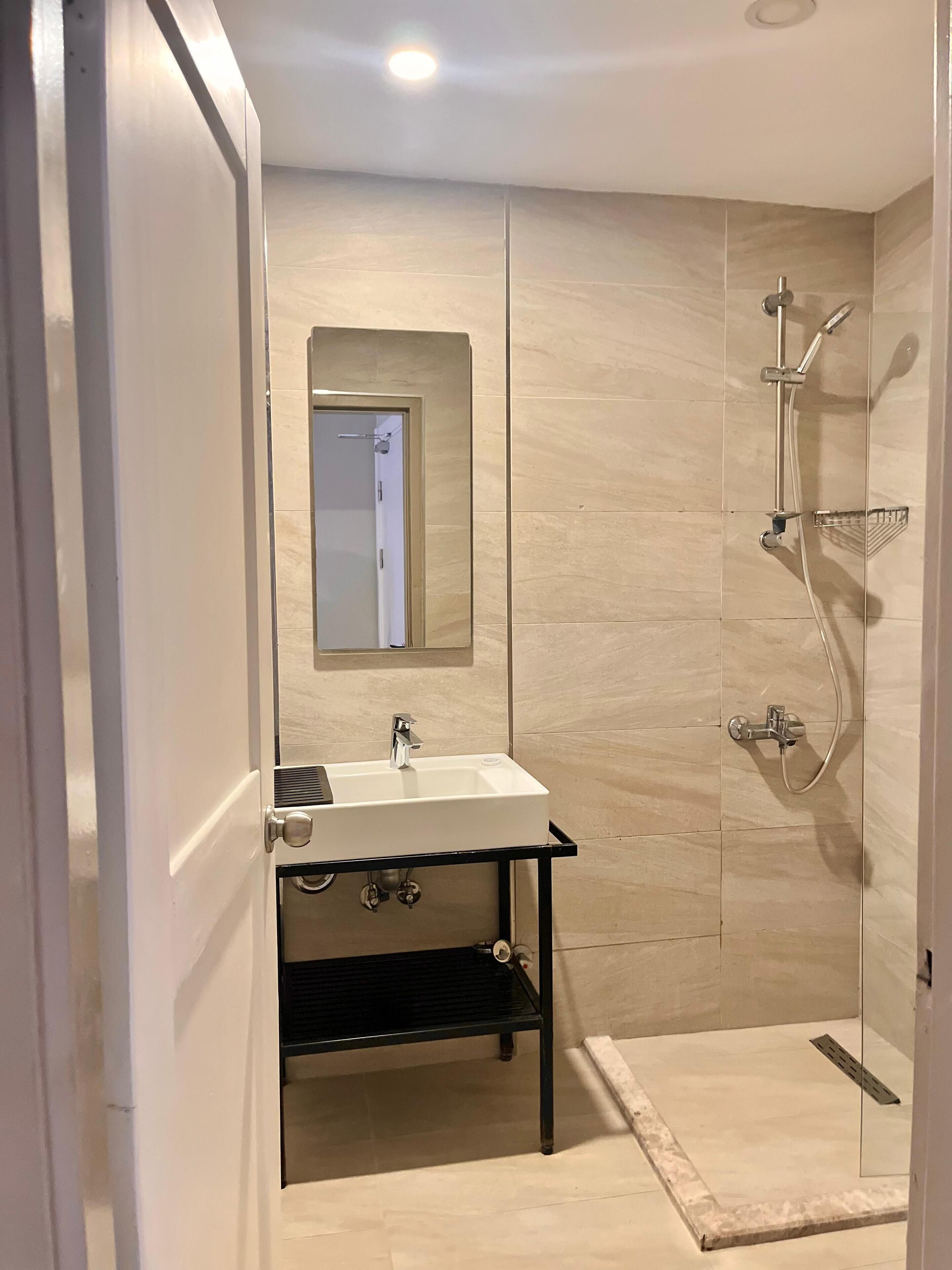 shower, hair dryer, bidet, towels