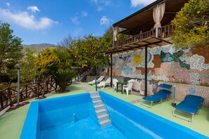 Seasonal outdoor pool, pool loungers