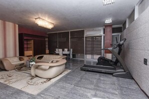 Luxury Apartment, Multiple Beds | Living area | Flat-screen TV, DVD player, streaming services - Deluxe Boutique Hotel (Baku)