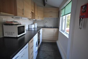 Cottage, 3 Bedrooms, Sea View | Private kitchen | Fridge, microwave, oven, stovetop