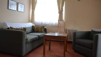 Apartment, 1 Bedroom | Living area | Flat-screen TV