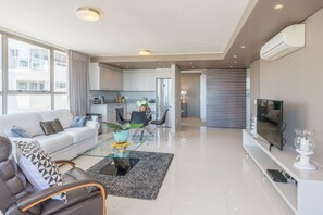 Royal Condo, 2 Bedrooms, Balcony, Park View | Living area | Flat-screen TV, pay movies - Legacy Presidential Suite (Cape Town)