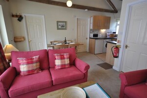 Cottage, 2 Bedrooms | Living room | Flat-screen TV, DVD player, iPod dock