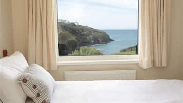 Apartamento, 5 quartos, 2 banheiros, vista para o mar | 5 quartos, berços grátis, Wi-Fi de cortesia, roupa de cama