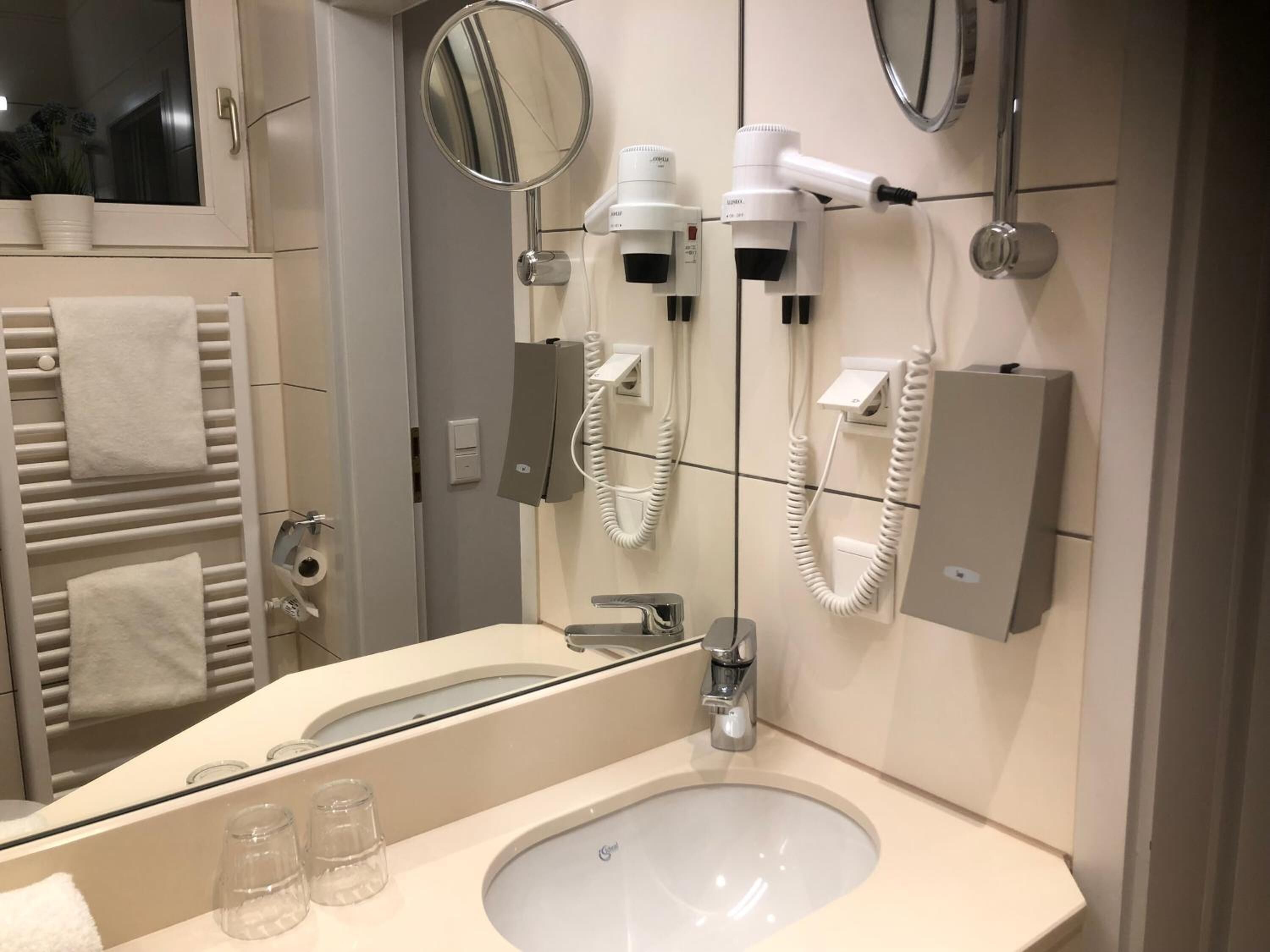 shower, hair dryer, bathrobes, slippers