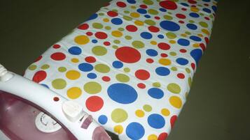 A polka-dotted fabric laid out on a flat surface.