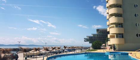 Indoor pool, outdoor pool, pool umbrellas, pool loungers