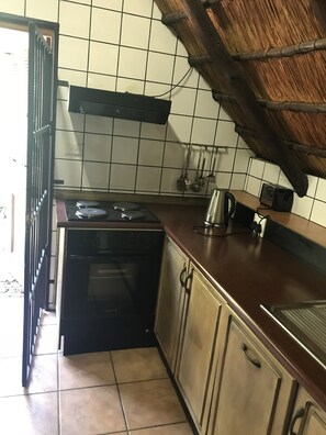 Family Studio Suite, 1 Bedroom, Non Smoking, Garden View | Private kitchen | Fridge, coffee/tea maker, cookware/dishes/utensils