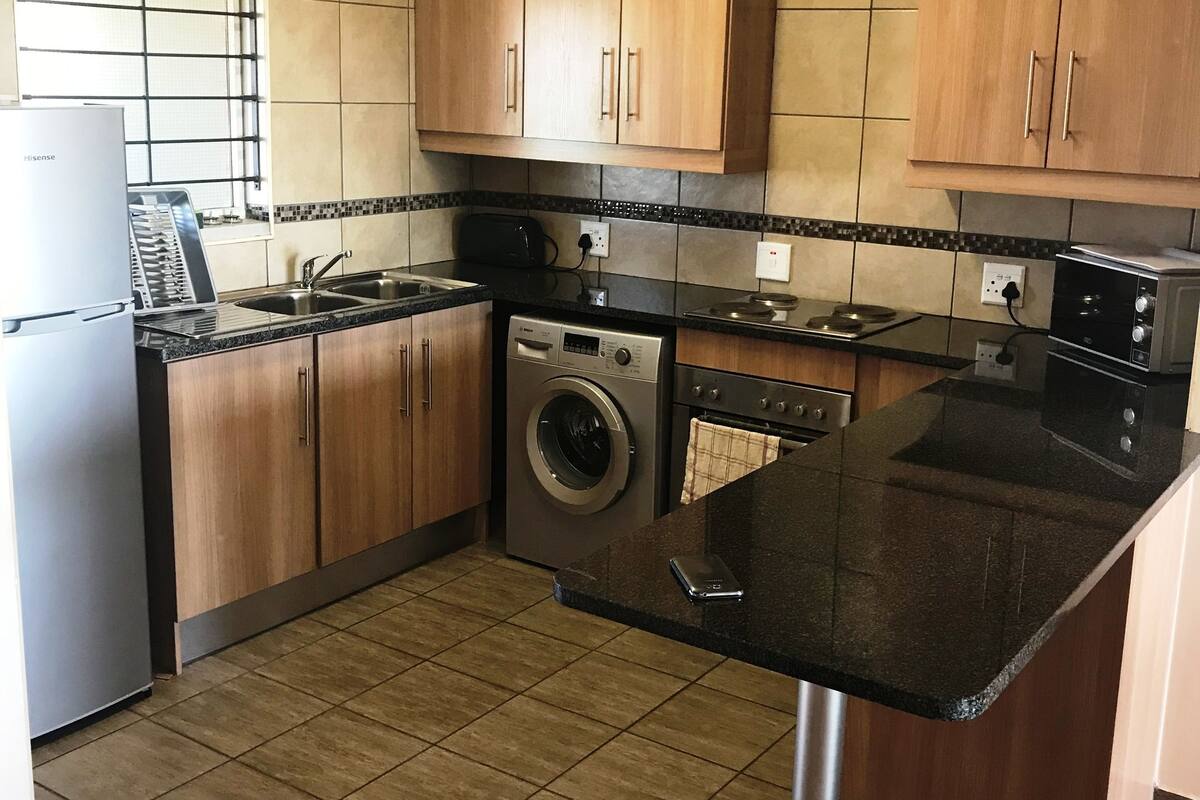Coffee/tea maker, fridge, cookware/dishes/utensils