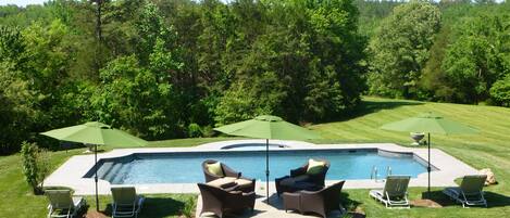 Seasonal outdoor pool, open 6 AM to midnight, pool umbrellas