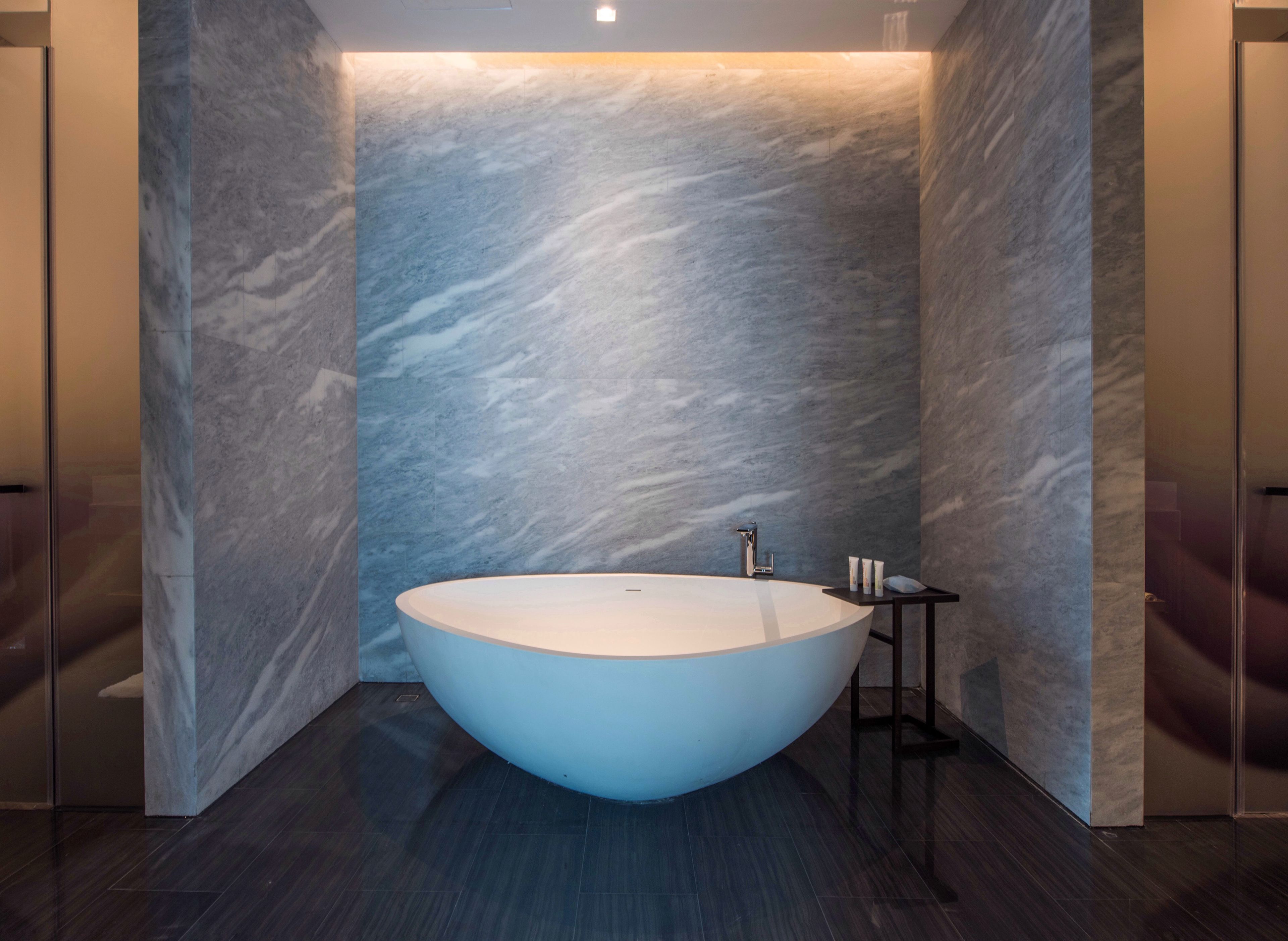 executive suite, 1 king bed, city view | bathroom | separate bathtub and shower, hair dryer, bathrobes, slippers