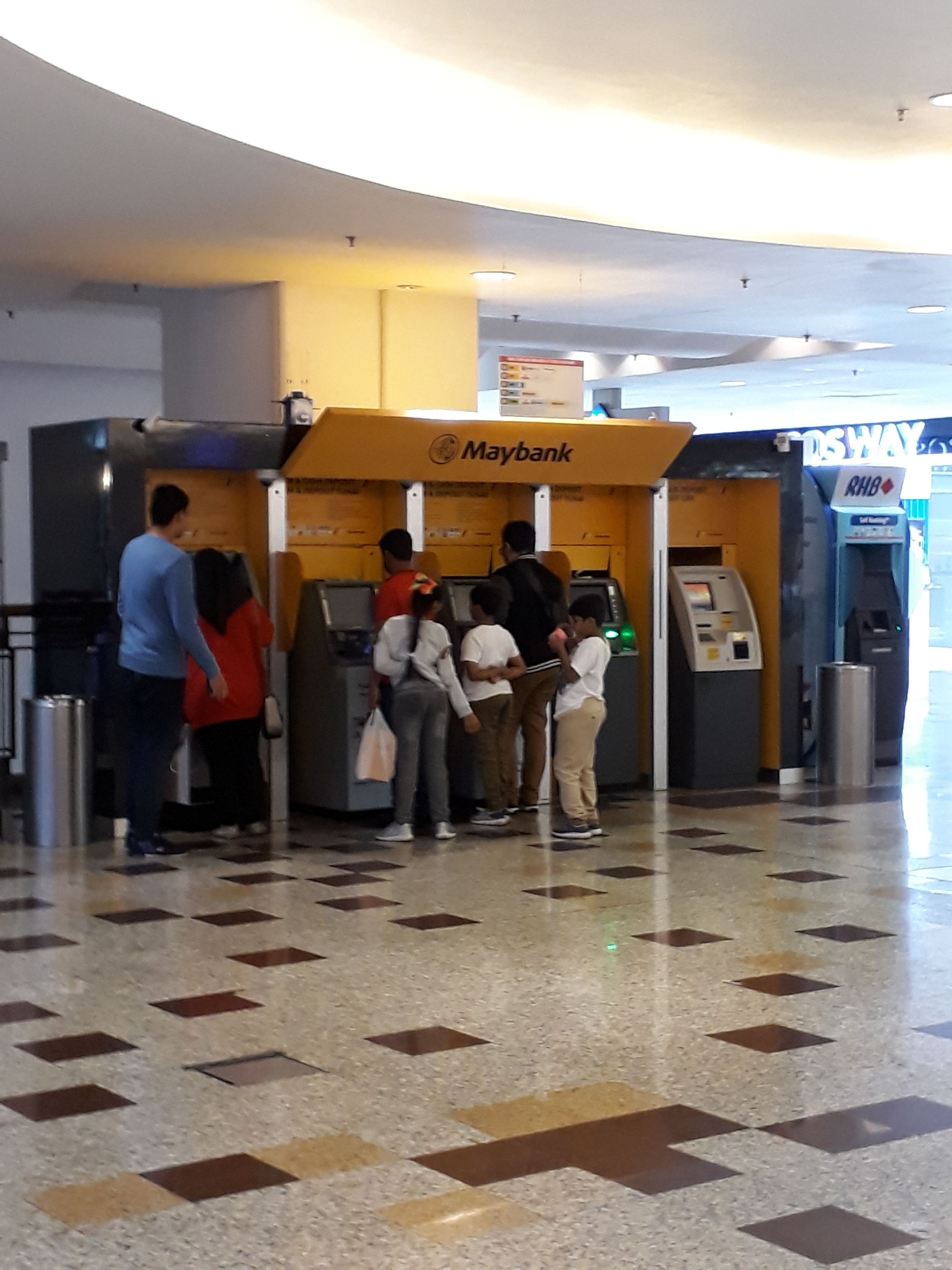 A bank with a Maybank ATM and a RHB ATM.