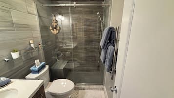 Shower, hair dryer, towels, soap