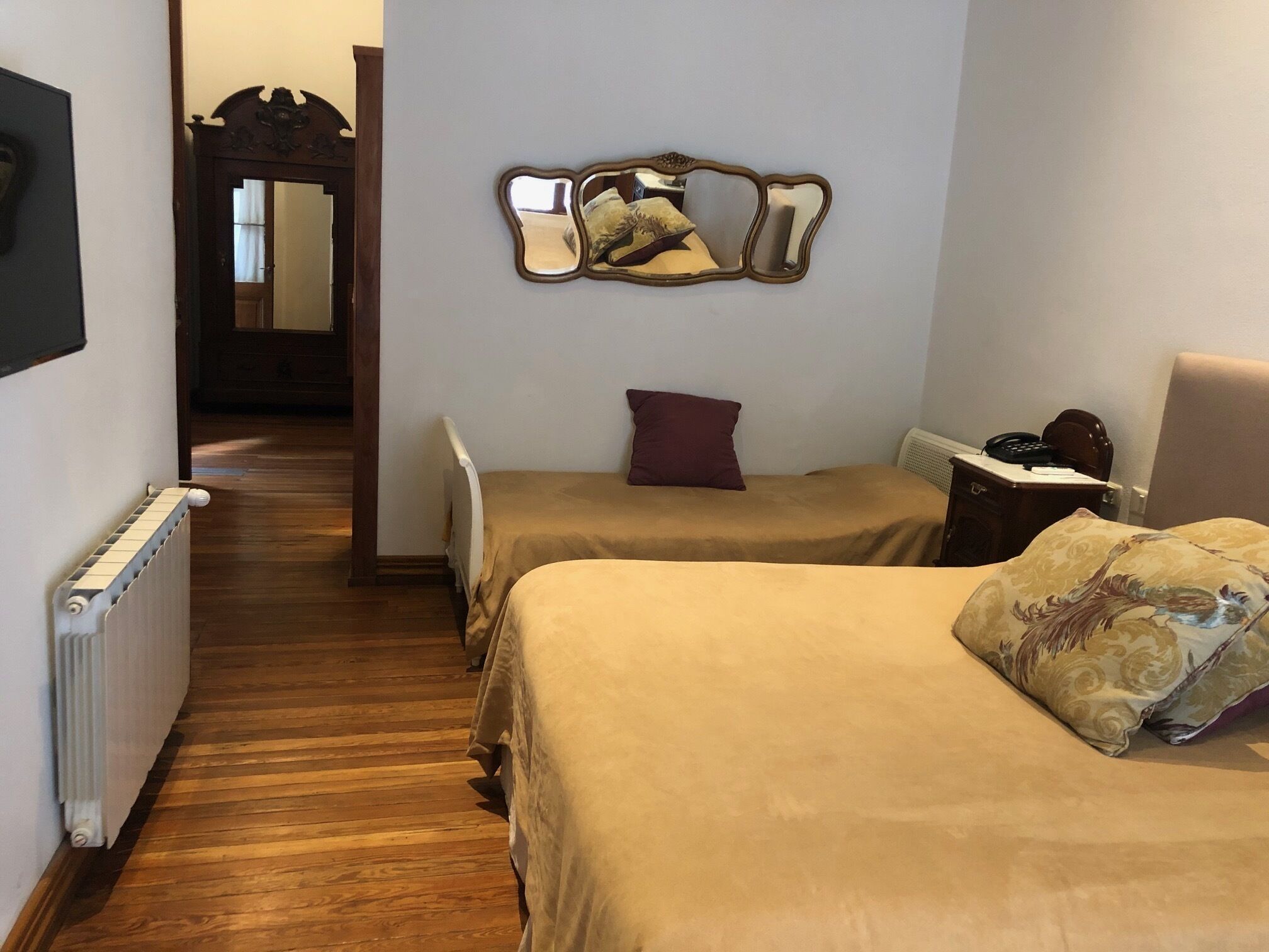 standard triple room, multiple beds, garden view | view from room