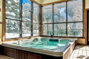 Relax in a serene mountain setting with a spacious hot tub and expansive views.