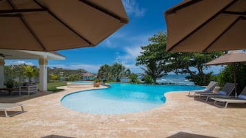 Outdoor pool, pool umbrellas, sun loungers
