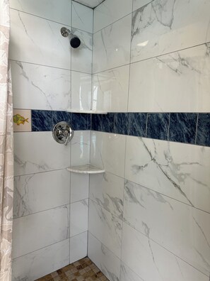 Combined shower/tub, hair dryer, towels, soap
