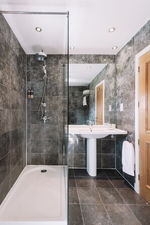 Combined shower/tub, hair dryer, towels, soap