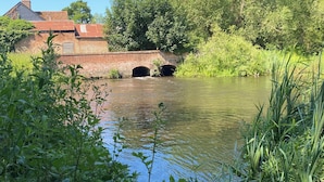 A canal with a brick bridge and greenery. - Cozy cabin in nature! A great base to relax or explore North Norfolk . (Norfolk)