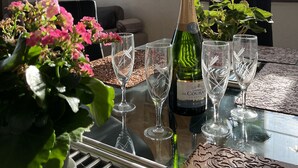 A table with a bottle of champagne, two glasses, and a decorative tray. - FRANCE NICE PROMENADE OF ENGLISH 80 m2 PIANO    (Nice)
