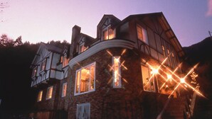 A large, two-story house with multiple windows and a prominent staircase. - Fujikawaguchiko Crescendo (Fujikawaguchiko)