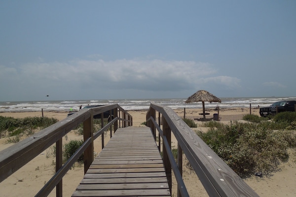 Beach nearby, sun loungers
