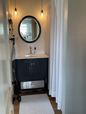 Combined shower/tub, hair dryer, towels, soap