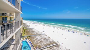 A beachfront hotel with a pool, beach access, and ocean views.