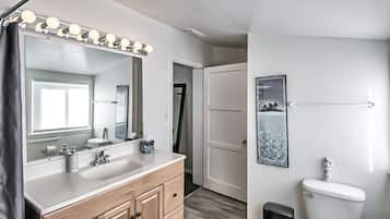 Bathtub, hair dryer, towels, soap