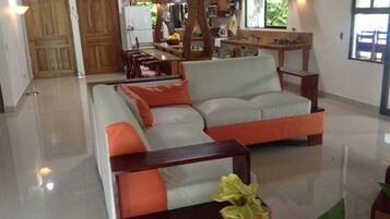 Deluxe House, 3 Bedrooms | Living area | Flat-screen TV