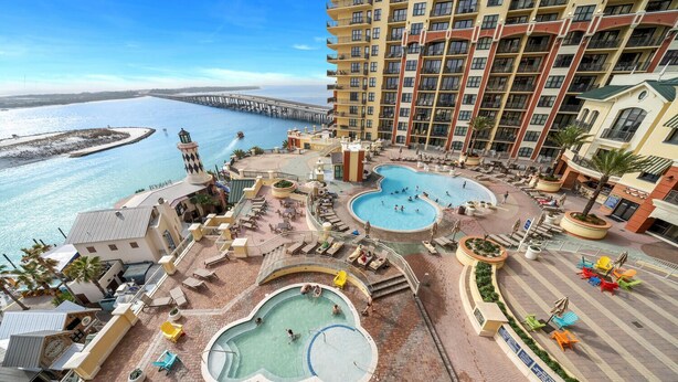 A resort with multiple swimming pools, a beach, and a pier. - Emerald Grande🐠🐠Corner Unit ⛵️ Incredible Gulf Views⛱️Beach Serv Incl 🩴Ev Chargers (Destin)