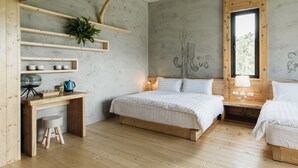 A bedroom with a wooden desk, two beds, a window, and a wall-mounted shelf with a plant. - Sun Moon Lake Residence 8 (Yuchi)