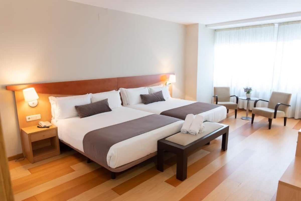 Family Quadruple Room | Desk, blackout drapes, iron/ironing board, free WiFi