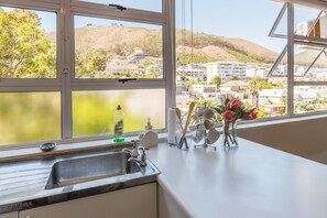 Design Studio Suite, 1 Bedroom, Mountain View | Private kitchen | Fridge, microwave, coffee/tea maker, electric kettle - Montclaire Suite 3 (Cape Town)