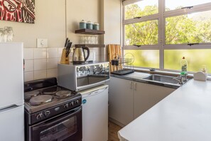 Design Studio Suite, 1 Bedroom, Mountain View | Private kitchen | Fridge, microwave, coffee/tea maker, electric kettle - Montclaire Suite 3 (Cape Town)