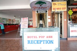 A hotel reception area with a sign indicating 'Hotel Pop Ash Reception'. - Hotel Pop Ash (Brinchang)