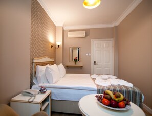 Standard Triple Room | Minibar, in-room safe, desk, laptop workspace - Mevlana Hotel (Istanbul)