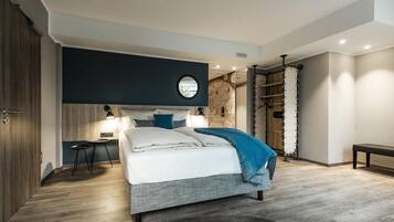 Une chambre à coucher moderne avec un lit, des tables de chevet et une armoire.