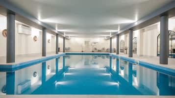 Indoor pool, open 8:00 AM to 8:00 PM, pool loungers
