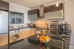 Elite Apartment, Balcony, City View | Private kitchen | Full-size fridge, microwave, oven, stovetop - The Icon Premium Suite (Cape Town)