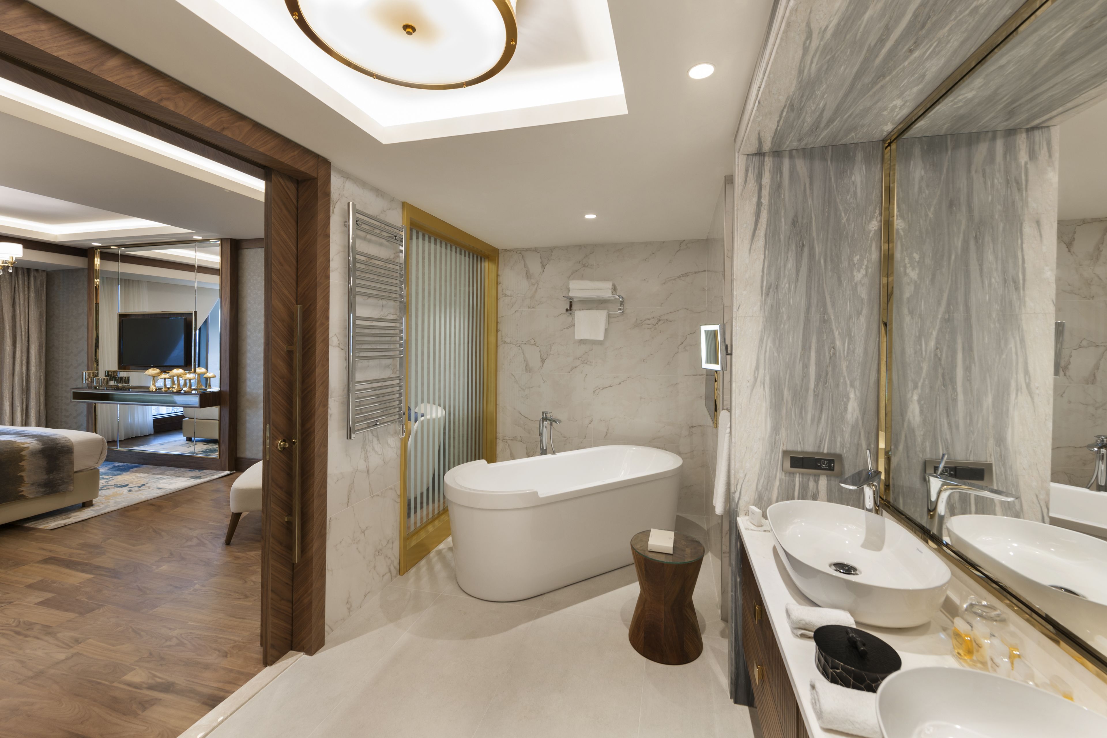 presidential suite with king size bed | bathroom | shower, free toiletries, hair dryer, slippers