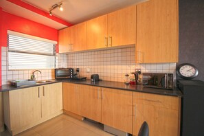 Full-size fridge, microwave, stovetop, electric kettle