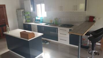 Bungalow, 2 Bedrooms, Non Smoking | Private kitchen | Full-size fridge, microwave, stovetop, highchair
