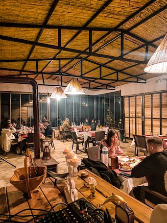 Breakfast, lunch, dinner served; local cuisine