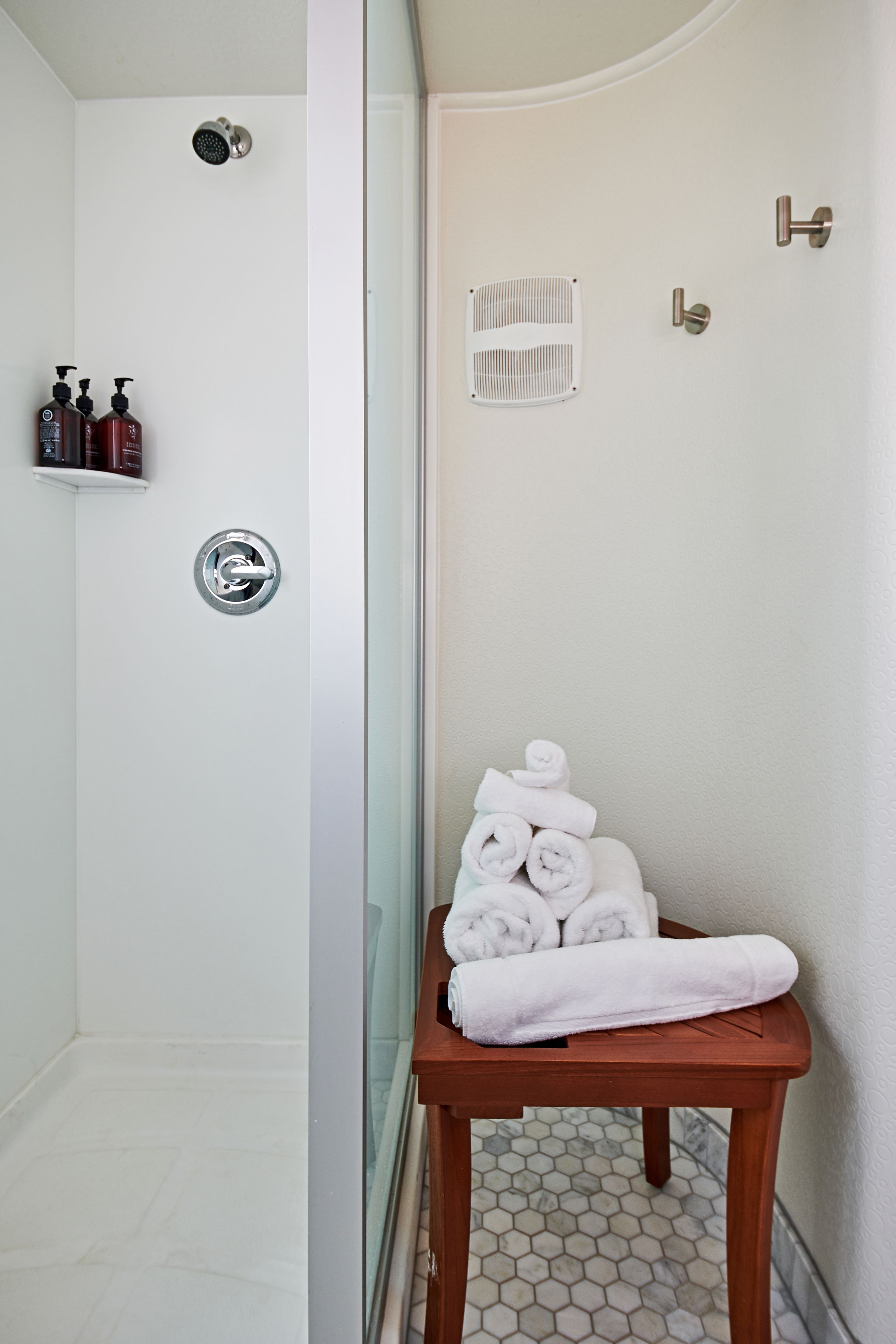 the navigator - premium room, 1 queen bed | bathroom | shower, free toiletries, hair dryer, towels