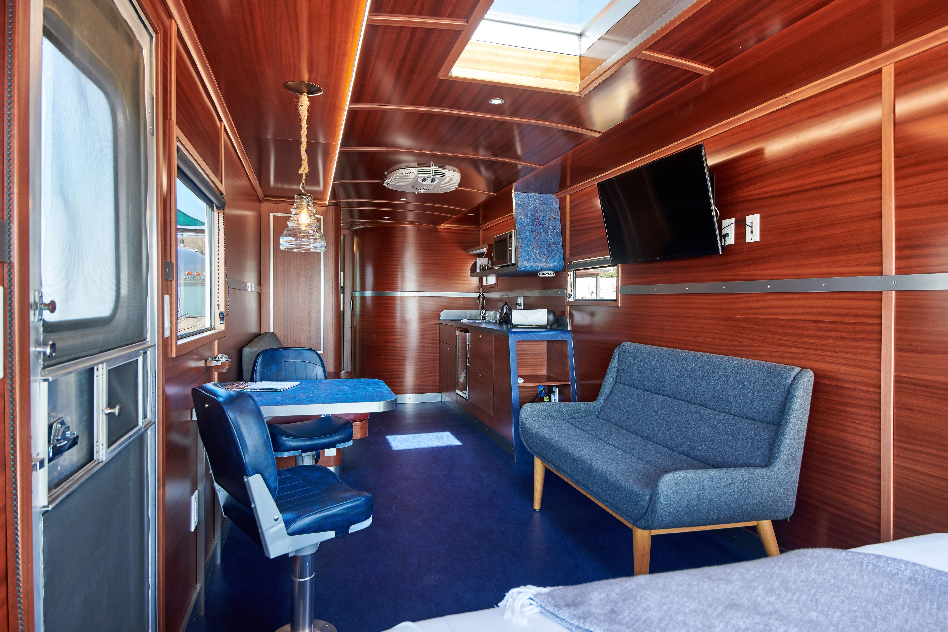 the navigator - premium room, 1 queen bed | living area | flat-screen tv