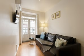 32-inch flat-screen TV with cable channels, TV, Netflix