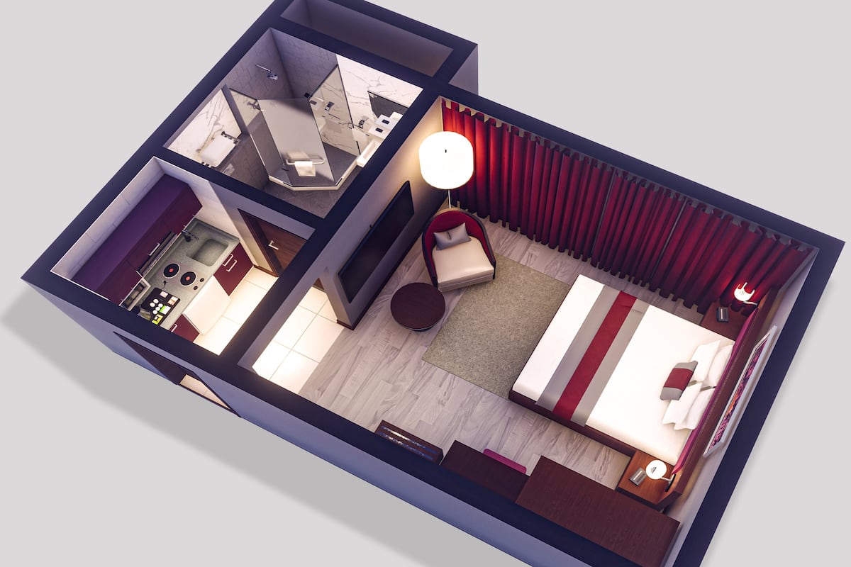 A 3D floor plan of a hotel room with a bathroom, a living area with a sofa and a TV, and a dining area with a table and chairs.