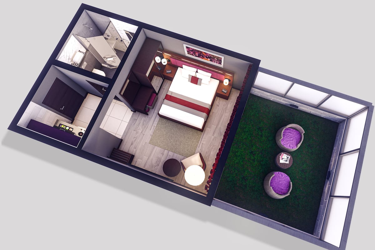 A 2D floor plan of a hotel room with a bed, bedside tables, a desk, a chair, a small table, and a seating area with three cushions.
